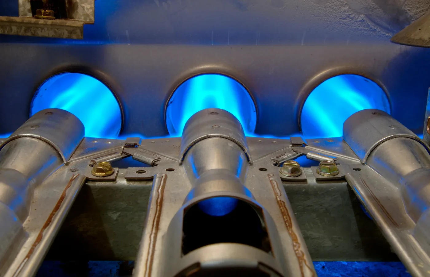Gas furnace burners glowing blue — heating repair Orlando FL