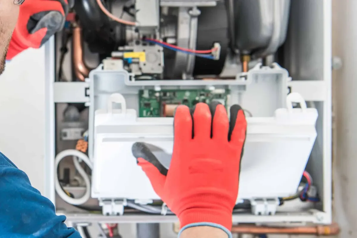 Smart Home Air & Heat technician servicing a heating system in an Orlando FL home